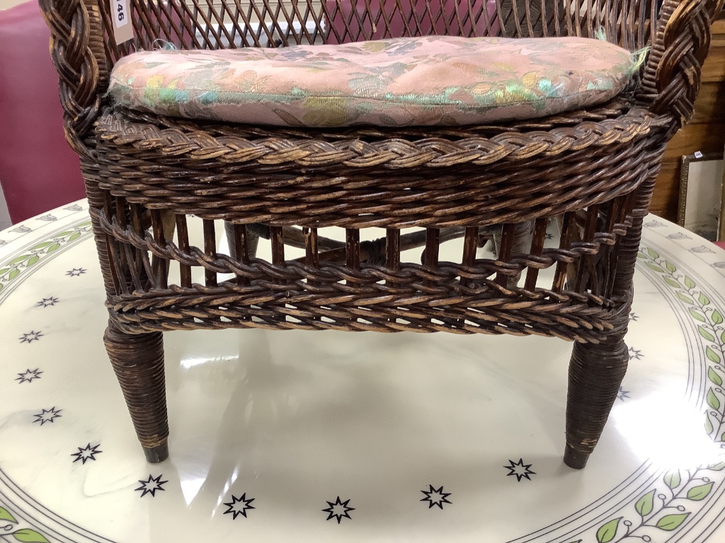 An early 20th century cane tub chair, width 80cm height 70cm